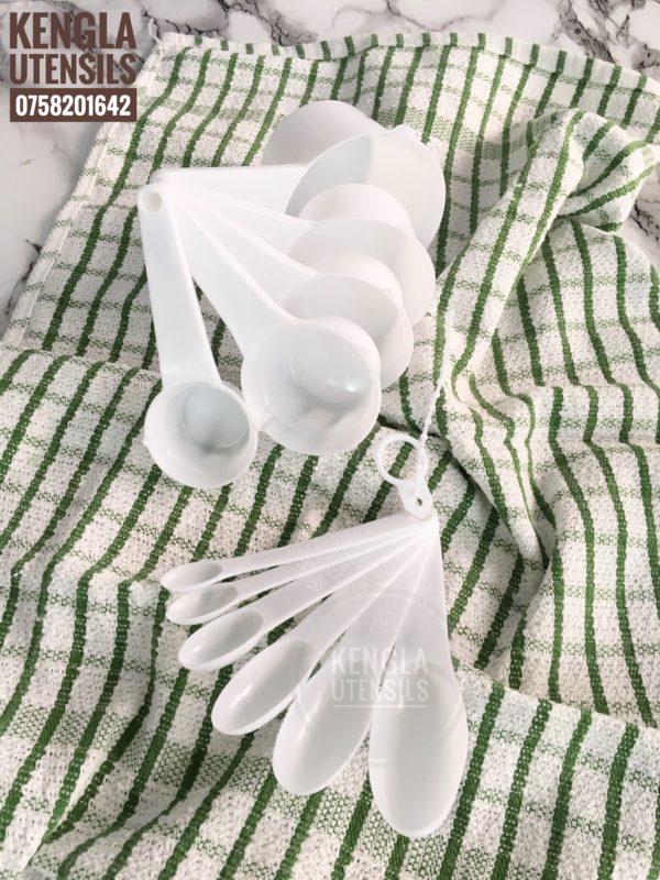 White 11 piece measuring cups and spoons.